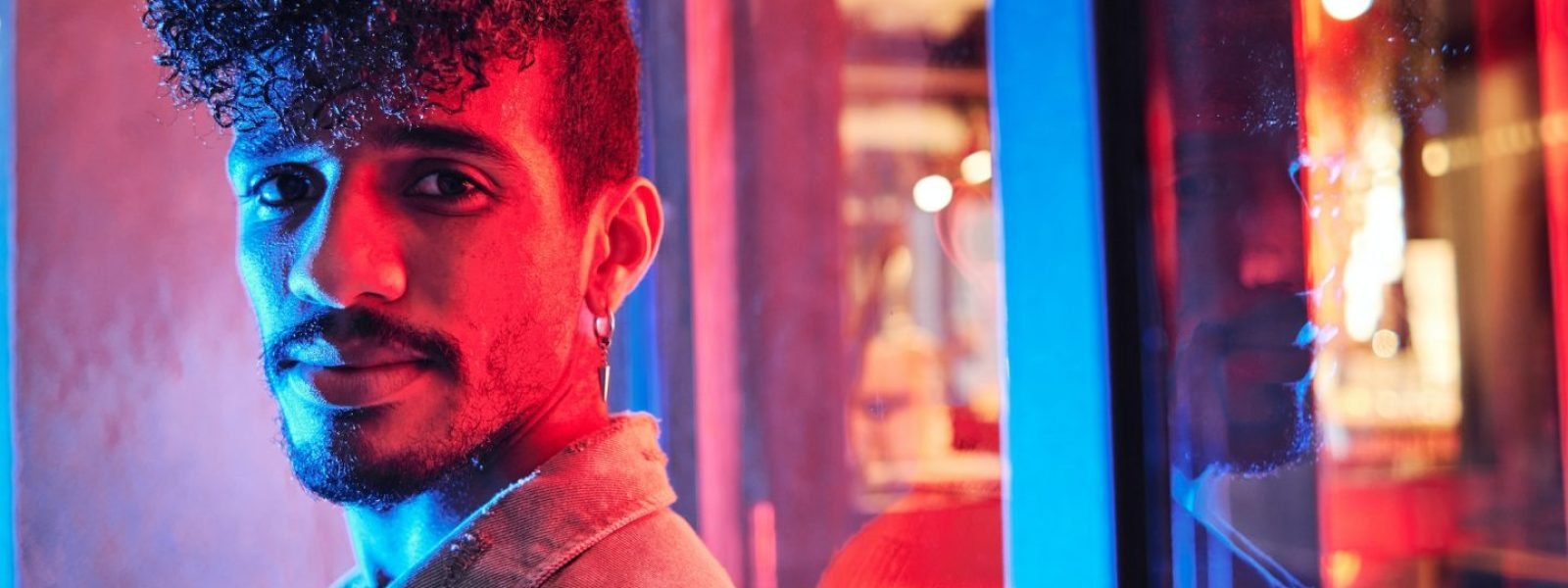 young-hispanic-man-close-to-a-neon-light-with-blue-and-red-lights-e1698314047406.jpg young-hispanic-man-close-to-a-neon-light-with-blue-and-red-lights-e1698314047406.jpg